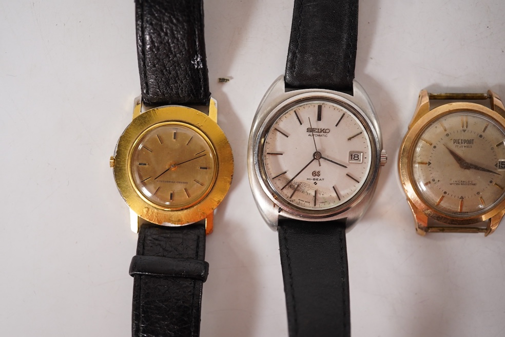 A gentleman's 1940's 9ct gold manual wind wrist watch(a.f.), together with four other wrist watches including Seiko, gold plated Girard Perregaux and Baume & Mercier Baumatic. Condition - poor to fair